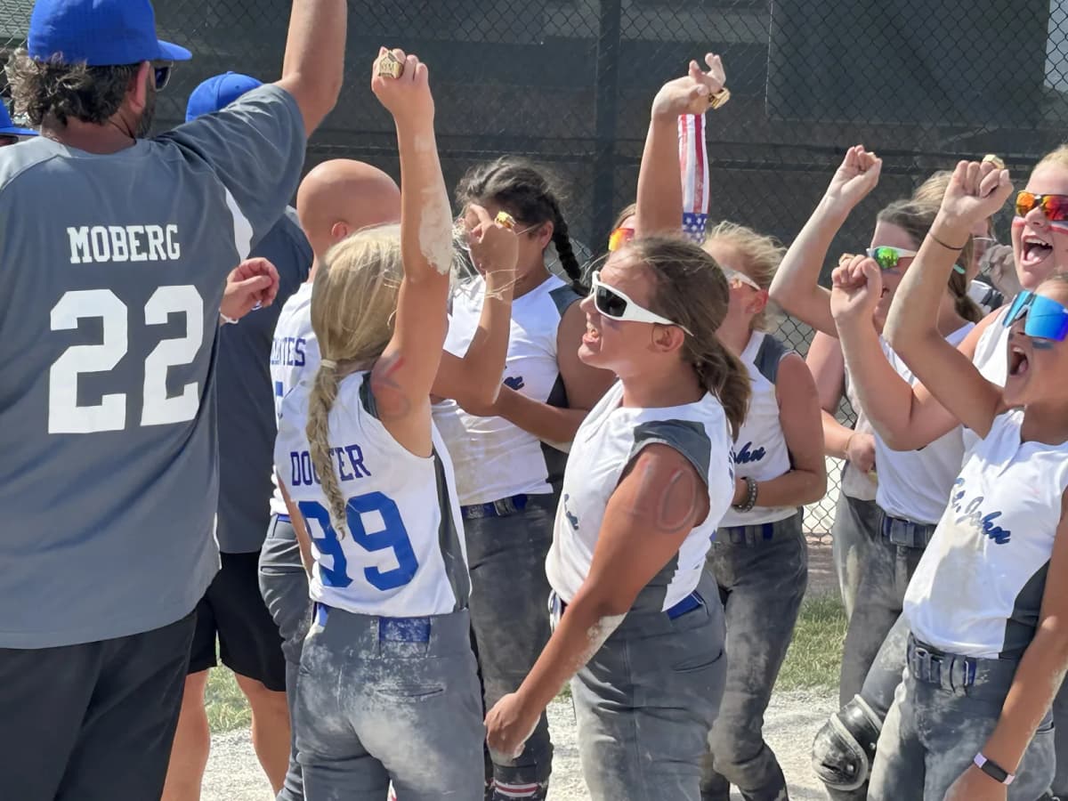 Bryan's youth softball team celebrating a win