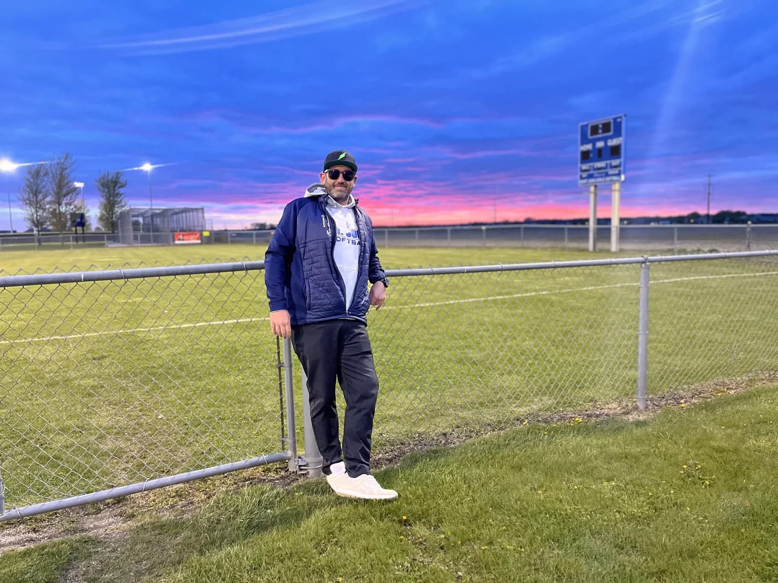 Bryan Moberg, founder of MOments Sports, at the field at sunset