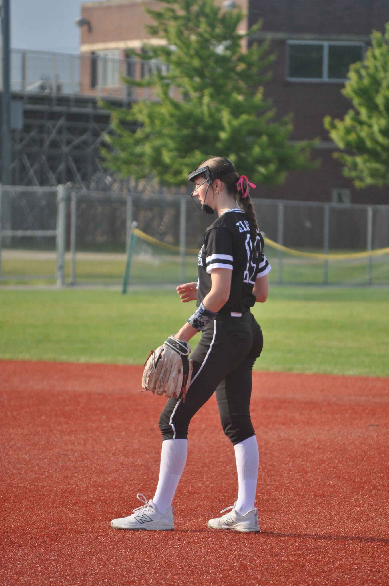 Delilah Klausner on the softball field with her glove