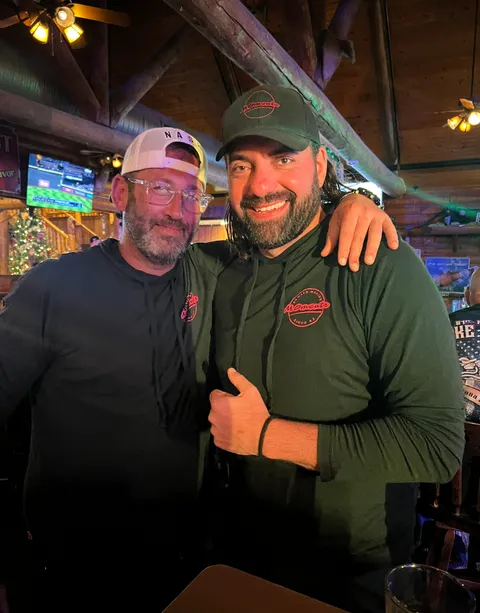 Two friends catching up after the round
