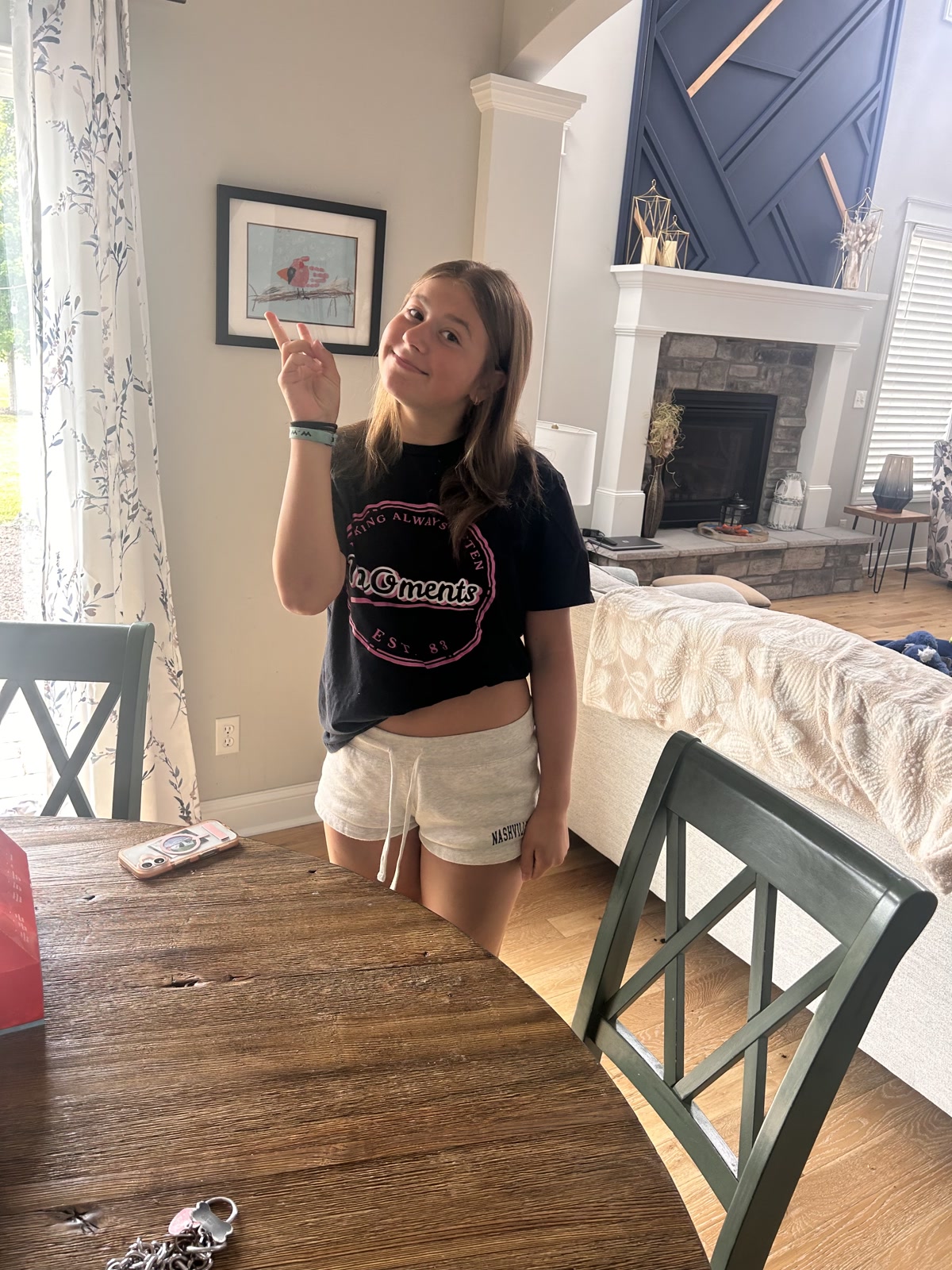 A young supporter wearing a black MOments shirt
