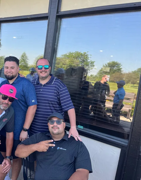 The crew posted up outside the clubhouse